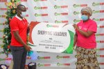 Username Investment Limited Sales & Marketing Director, Joseph Gitonga (left) gifting Zipporah...jpg