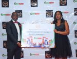 Joseph Gitonga, Director & Head of Sales & Marketing awarding Dorina Mirembo, Sales Team Leade...jpg